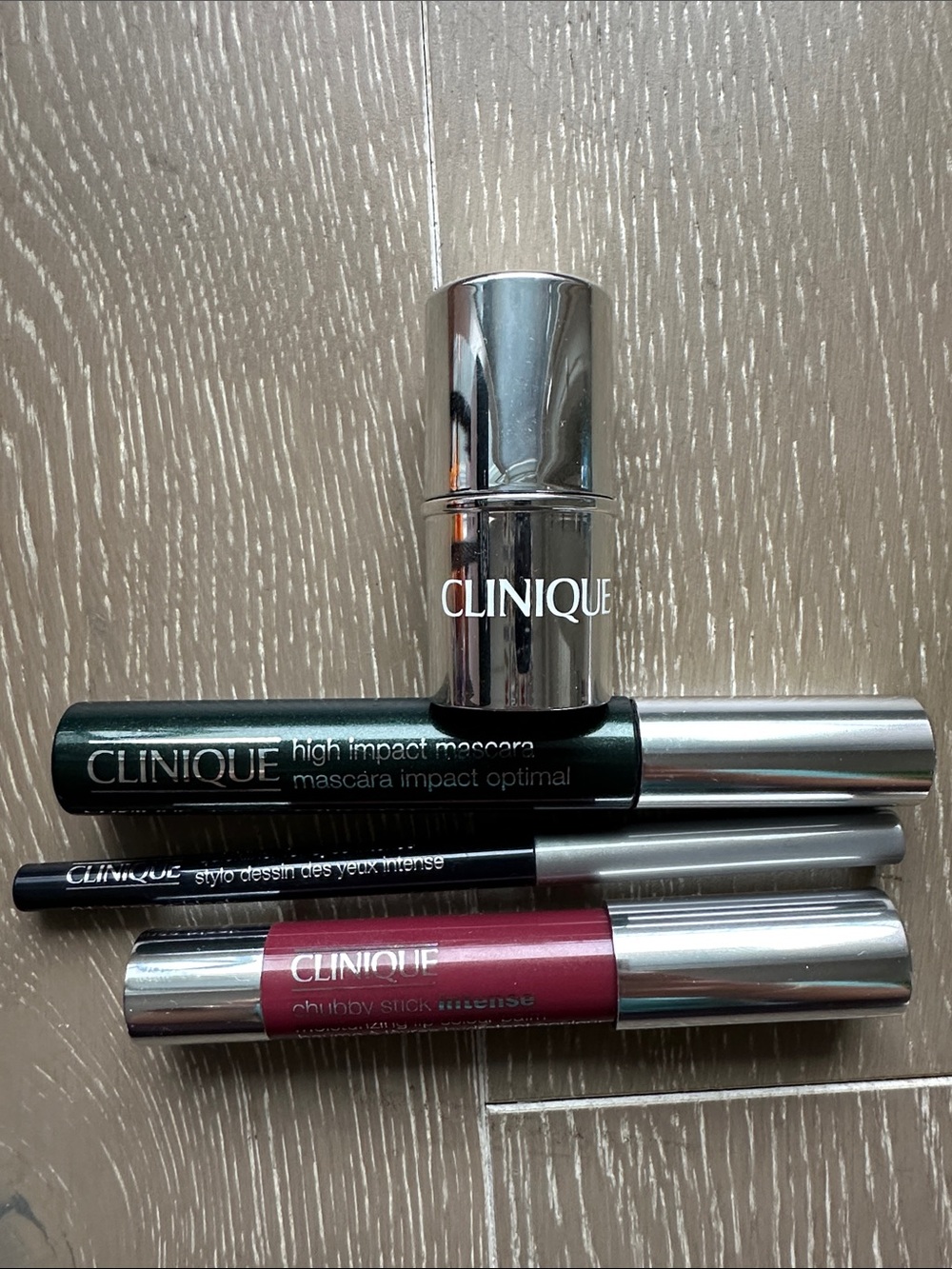 Clinique makeup lot high impact mascara, eyeliner, cream blush, lip color balm